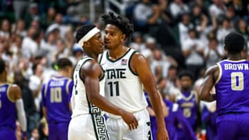 Michigan State's Tyson Walker, left, celebrates with A.J. Hoggard after Walker scored against James Madison during the second half on Monday, Nov. 6, 2023, in East Lansing.