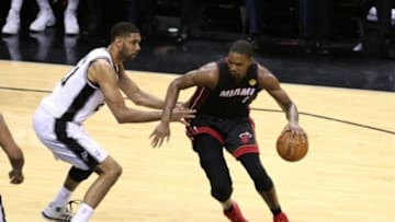Jun 15, 2014; San Antonio, TX, USA; Miami Heat forward Chris Bosh (1) drives in the second half against San Antonio Spurs froward Tim Duncan (21) in game five of the 2014 NBA Finals at AT&T Center. Mandatory Credit: Soobum Im-USA TODAY Sports