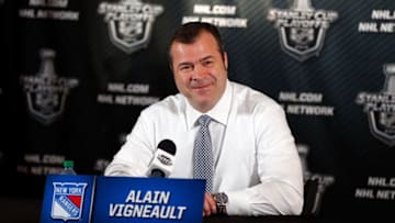 TAMPA, FL - MAY 26: Alain Vigneault of the New York Rangers speaks to the media after defeating the Tampa Bay Lightning in Game Six of the Eastern Conference Finals during the 2015 NHL Stanley Cup Playoffs at Amalie Arena on May 26, 2015 in Tampa, Florida. (Photo by Mike Carlson/Getty Images)