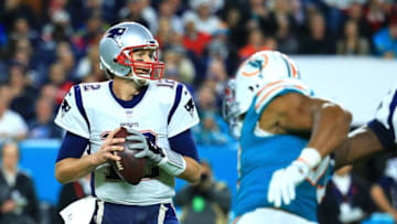 MIAMI GARDENS, FL - DECEMBER 11: Tom Brady #12 of the New England Patriots looks to pass during the fourth quarter against the Miami Dolphins at Hard Rock Stadium on December 11, 2017 in Miami Gardens, Florida. (Photo by Chris Trotman/Getty Images)