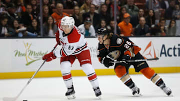 ANAHEIM, CA - DECEMBER 11: Jeff Skinner #53 of the Carolina Hurricanes battles Carl Hagelin #26 of the Anaheim Ducks for a loose puck during a game at Honda Center on December 11, 2015 in Anaheim, California. (Photo by Sean M. Haffey/Getty Images)