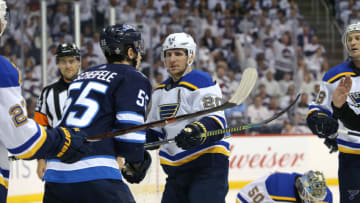 WINNIPEG, MANITOBA - APRIL 18: Alexander Steen #20 of the St. Louis Blues confronts Mark Scheifele #55 of the Winnipeg Jets after a whistle in Game Five of the Western Conference First Round during the 2019 NHL Stanley Cup Playoffs at Bell MTS Place on April 18, 2019 in Winnipeg, Manitoba, Canada. (Photo by Jason Halstead/Getty Images)