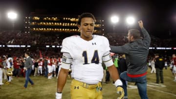 PALO ALTO, CA - NOVEMBER 28: DeShone Kizer #14 of the Notre Dame Fighting Irish walks off the field after they lost to the Stanford Cardinal on a last-second field goal at Stanford Stadium on November 28, 2015 in Palo Alto, California. (Photo by Ezra Shaw/Getty Images)