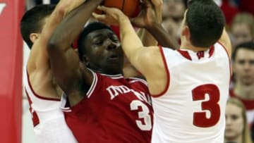 Jan 26, 2016; Madison, WI, USA; Indiana Hoosiers forward OG Anunoby (3) fights for a rebound with Wisconsin Badgers guard Zak Showalter (3) and teammate Ethan Happ (left) at the Kohl Center. Wisconsin defeated Indiana 82-79 (OT). Mandatory Credit: Mary Langenfeld-USA TODAY Sports