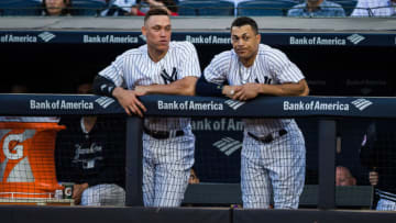 NEW YORK, NY - MAY 30: Giancarlo Stanton #27 and Aaron Judge #99 of the New York Yankees look on during the game against the Houston Astros at Yankee Stadium on Wednesday May 30, 2018 in the Bronx borough of New York City. (Photo by Rob Tringali/SportsChrome/Getty Images)