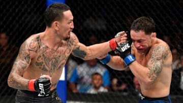 EDMONTON, ALBERTA - JULY 27: (L-R) Max Holloway punches Frankie Edgar in their UFC featherweight championship bout during the UFC 240 event at Rogers Place on July 27, 2019 in Edmonton, Alberta, Canada. (Photo by Jeff Bottari/Zuffa LLC/Zuffa LLC)