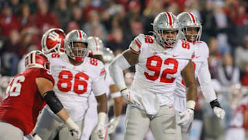 Ohio State Buckeyes defensive tackle Haskell Garrett (92) celebrates a sack of Indiana Hoosiers quarterback Jack Tuttle (14) during the first quarter of the NCAA football game at Memorial Stadium in Bloomington, Ind. on Saturday, Oct. 23, 2021.Ohio State Buckeyes At Indiana Hoosiers
