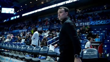 URI coach Archie Miller takes the court for the second half.