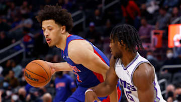 Detroit Pistons guard Cade Cunningham (2) is defended by Sacramento Kings guard Davion Mitchell Credit: Rick Osentoski-USA TODAY Sports