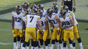 WEST LAFAYETTE, IN - OCTOBER 24: Members of the Iowa Hawkeyes offense huddle during the first half against the Purdue Boilermaker at Ross-Ade Stadium on October 24, 2020 in West Lafayette, Indiana. (Photo by Michael Hickey/Getty Images)