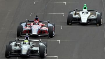 May 26, 2013; Indianapolis, IN, USA; IndyCar Series driver Tony Kanaan (11) leads Marco Andretti (25) and Ed Carpenter (20) during the 2013 Indianapolis 500 at Indianapolis Motor Speedway. Mandatory Credit: Brian Spurlock-USA TODAY Sports