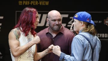 LOS ANGELES, CA - JULY 26: Dana White (C), UFC President, separates the two fighters Cris Cyborg (L) and Tonya Evingeras they face off during the UFC 214 Press Conference at The Novo by Microsoft July 26, 2017, in Los Angeles, California. (Photo by Kevork Djansezian/Zuffa LLC via Getty Images)