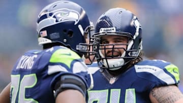 Nov 4, 2012; Seattle, WA, USA; Seattle Seahawks tackle Russell Okung (76) and guard John Moffitt (74) talk prior to the game against the Minnesota Vikings at CenturyLink Field. Seattle defeated Minnesota 30-20. Mandatory Credit: Steven Bisig-USA TODAY Sports