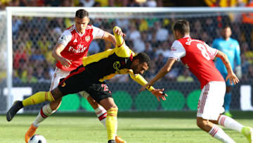 WATFORD, ENGLAND - SEPTEMBER 15: Etienne Capoue of Watford battles with Granit Xhaka of Arsenal during the Premier League match between Watford FC and Arsenal FC at Vicarage Road on September 15, 2019 in Watford, United Kingdom. (Photo by Julian Finney/Getty Images)