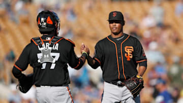 GLENDALE, AZ - MARCH 07: Jose Dominguez #53 of the San Francisco Giants shakes hands with Aramis Garcia #77 after the spring training game against the Los Angeles Dodgers at Camelback Ranch on March 7, 2017 in Glendale, Arizona. (Photo by Tim Warner/Getty Images)