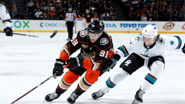 ANAHEIM, CA - MARCH 22: Jakob Silfverberg #33 of the Anaheim Ducks controls the puck with pressure from Brenden Dillon #4 of the San Jose Sharks during the game on March 22, 2019 at Honda Center in Anaheim, California. (Photo by Debora Robinson/NHLI via Getty Images)