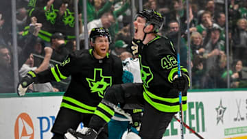 Dec 31, 2022; Dallas, Texas, USA; Dallas Stars left wing Fredrik Olofsson (42) and center Joe Pavelski (16) celebrate after Olofsson scores his first career NHL goal against San Jose Sharks goaltender James Reimer (not pictured) during the second period at the American Airlines Center. Mandatory Credit: Jerome Miron-USA TODAY Sports