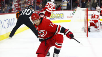 RALEIGH, NORTH CAROLINA - DECEMBER 16: Tony DeAngelo #77 of the Carolina Hurricanes celebrates a goal scored during the first period of the game against the Detroit Red Wings at PNC Arena on December 16, 2021 in Raleigh, North Carolina. (Photo by Jared C. Tilton/Getty Images)