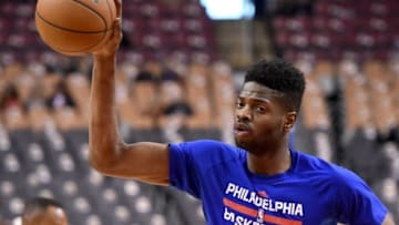 Apr 12, 2016; Toronto, Ontario, CAN; Philadelphia 76ers forward Nerlens Noel (4) takes a pass during shooting drills prior to playing Toronto Raptors at Air Canada Centre. Mandatory Credit: Dan Hamilton-USA TODAY Sports