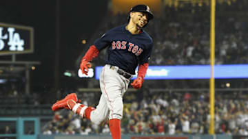 LOS ANGELES, CA - OCTOBER 28: Mookie Betts #50 of the Boston Red Sox celebrates his sixth inning home run against the Los Angeles Dodgers in Game Five of the 2018 World Series at Dodger Stadium on October 28, 2018 in Los Angeles, California. (Photo by Harry How/Getty Images)