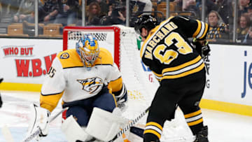 BOSTON, MA - DECEMBER 22: Boston Bruins left wing Brad Marchand (63) tries to jam the puck underneath Nashville Predators goalie Pekka Rinne (35) during a game between the Boston Bruins and the Nashville Predators on December 22, 2018, at TD Garden in Boston, Massachusetts. (Photo by Fred Kfoury III/Icon Sportswire via Getty Images)