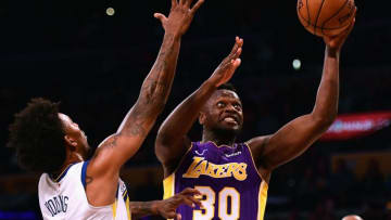 LOS ANGELES, CA - NOVEMBER 29: Julius Randle #30 of the Los Angeles Lakers scores over Nick Young #6 of the Golden State Warriors during a 127-123 Warriors overtime win at Staples Center on November 29, 2017 in Los Angeles, California. (Photo by Harry How/Getty Images)