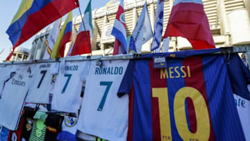 merchandise outside Estadio Santiago Bernabeu. Shirt of Cristiano Ronaldo of Real Madrid next to shirt of Lionel Messi of FC Barcelona during the UEFA Champions League semi final match between Real Madrid and Bayern Munich at the Santiago Bernabeu stadium on May 01, 2018 in Madrid, Spain(Photo by VI Images via Getty Images)