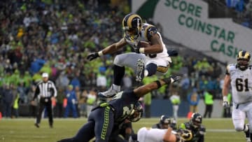 Dec 27, 2015; Seattle, WA, USA; St. Louis Rams running back Todd Gurley (30) hurdles Seattle Seahawks free safety Earl Thomas (29) during an NFL football game at CenturyLink Field. The Rams defeated the Seahawks 23-17. Mandatory Credit: Kirby Lee-USA TODAY Sports