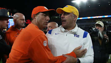 Oct 23, 2021; Pittsburgh, Pennsylvania, USA; Clemson Tigers head coach Dabo Swinney (left) congratulates Pittsburgh Panthers head coach Pat Narduzzi (right) after the game at Heinz Field. Pittsburgh won 27-17. Mandatory Credit: Charles LeClaire-USA TODAY Sports