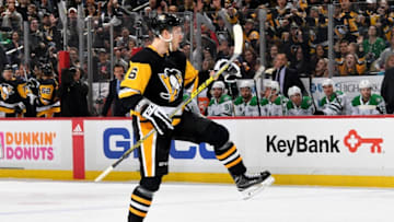 PITTSBURGH, PA - MARCH 11: Jamie Oleksiak #6 of the Pittsburgh Penguins celebrate his first period goal against the Dallas Stars at PPG Paints Arena on March 11, 2018 in Pittsburgh, Pennsylvania. (Photo by Joe Sargent/NHLI via Getty Images)