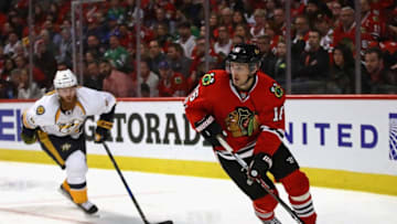 CHICAGO, IL - APRIL 13: Marcus Kruger #16 of the Chicago Blackhawks looks to pass in front of Ryan Ellis #4 of the Nashville Predators in Game One of the Western Conference First Round during the 2017 NHL Stanley Cuo Playoffs at the United Center on April 13, 2017 in Chicago, Illinois. The Predators defeated the Blackhawks 1-0. (Photo by Jonathan Daniel/Getty Images)
