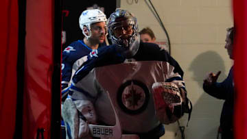 Apr 21, 2022; Raleigh, North Carolina, USA; Winnipeg Jets goaltender Eric Comrie (1) comes out of the lock room against the Carolina Hurricanes before the game at PNC Arena. Mandatory Credit: James Guillory-USA TODAY Sports
