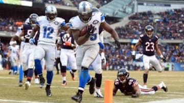 Dec 21, 2014; Chicago, IL, USA; Detroit Lions running back Joique Bell (35) rushes into the end zone for a touchdown during the fourth quarter against the Chicago Bears at Soldier Field. Mandatory Credit: Andrew Weber-USA TODAY Sports