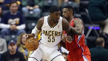 Jan 18, 2014; Indianapolis, IN, USA; Indiana Pacers center Roy Hibbert (55) is guarded by Los Angeles Clippers center DeAndre Jordan (6) at Bankers Life Fieldhouse. Mandatory Credit: Brian Spurlock-USA TODAY Sports