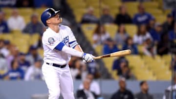 LOS ANGELES, CA - MAY 08: Enrique Hernandez #14 of the Los Angeles Dodgers watches his solo homerun to tie the game 5-5 with the Arizona Diamondbacks during the ninth inning at Dodger Stadium on May 8, 2018 in Los Angeles, California. (Photo by Harry How/Getty Images)