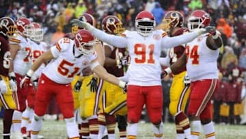 Dec 8, 2013; Landover, MD, USA; Kansas City Chiefs linebacker Tamba Hali (91) celebrates after sacking Washington Redskins quarterback Robert Griffin III (not shown) during the second quarter at FedEx Field. Mandatory Credit: Brad Mills-USA TODAY Sports