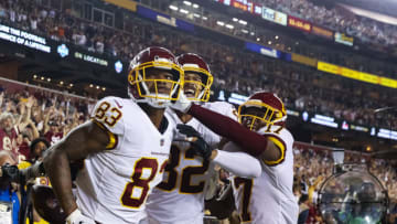 LANDOVER, MARYLAND - SEPTEMBER 16: Ricky Seals-Jones #83 of the Washington Football Team, Terry McLaurin #17 and Logan Thomas #82 celebrate a touchdown together during the fourth quarter against the New York Giants at FedExField on September 16, 2021 in Landover, Maryland. (Photo by Patrick Smith/Getty Images)