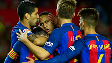 Barcelona's Argentinian forward Lionel Messi (2ndL) celebrates with Barcelona's Uruguayan forward Luis Suarez (L), Barcelona's Brazilian forward Neymar (C) and teammates after scoring during the Spanish league football match Sevilla FC vs FC Barcelona at the Ramon Sanchez Pizjuan stadium in Sevilla on November 6, 2016. / AFP / CRISTINA QUICLER (Photo credit should read CRISTINA QUICLER/AFP/Getty Images)