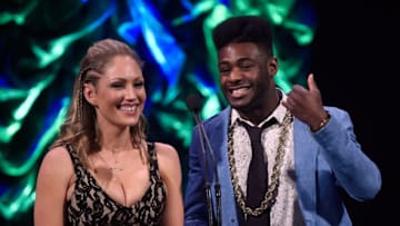 LAS VEGAS, NV - MARCH 02: Ring card girl Jade Bryce (L) and mixed martial artist Aljo Sterling present the Best MMA Clothing and Equipment Brand of the Year award during the ninth annual Fighters Only World Mixed Martial Arts Awards at The Venetian Las Vegas on March 2, 2017 in Las Vegas, Nevada. (Photo by David Becker/WireImage)
