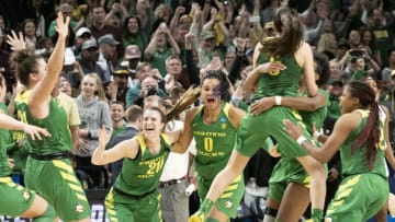 PORTLAND, OR - MARCH 31: Oregon Ducks guard Sabrina Ionescu (20) reacts with her teammate Oregon Ducks forward Satou Sabally (0) after the NCAA Division I Women's Championship Elite Eight round basketball game between the Oregon Ducks and Mississippi State Bulldogs on March 31, 2019 at Moda Center in Portland, Oregon. (Photo by Joseph Weiser/Icon Sportswire via Getty Images)