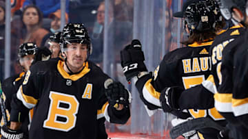 PHILADELPHIA, PENNSYLVANIA - OCTOBER 20: Brad Marchand #63 of the Boston Bruins celebrates with teammates after scoring during the second period against the Philadelphia Flyers at Wells Fargo Center on October 20, 2021 in Philadelphia, Pennsylvania. (Photo by Tim Nwachukwu/Getty Images)