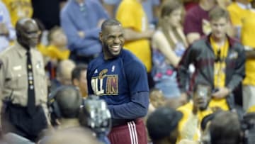 May 26, 2015; Cleveland, OH, USA; Cleveland Cavaliers forward LeBron James (23) reacts on the bench during the fourth quarter against the Atlanta Hawks in game four of the Eastern Conference Finals of the NBA Playoffs at Quicken Loans Arena. Mandatory Credit: David Richard-USA TODAY Sports