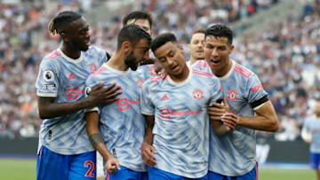 Manchester United's English midfielder Jesse Lingard (2nd R) celebrates with teammates after scoring their second goal during the English Premier League football match between West Ham United and Manchester United at The London Stadium, in east London on September 19, 2021. - RESTRICTED TO EDITORIAL USE. No use with unauthorized audio, video, data, fixture lists, club/league logos or 'live' services. Online in-match use limited to 120 images. An additional 40 images may be used in extra time. No video emulation. Social media in-match use limited to 120 images. An additional 40 images may be used in extra time. No use in betting publications, games or single club/league/player publications. (Photo by Ian KINGTON / AFP) / RESTRICTED TO EDITORIAL USE. No use with unauthorized audio, video, data, fixture lists, club/league logos or 'live' services. Online in-match use limited to 120 images. An additional 40 images may be used in extra time. No video emulation. Social media in-match use limited to 120 images. An additional 40 images may be used in extra time. No use in betting publications, games or single club/league/player publications. / RESTRICTED TO EDITORIAL USE. No use with unauthorized audio, video, data, fixture lists, club/league logos or 'live' services. Online in-match use limited to 120 images. An additional 40 images may be used in extra time. No video emulation. Social media in-match use limited to 120 images. An additional 40 images may be used in extra time. No use in betting publications, games or single club/league/player publications. (Photo by IAN KINGTON/AFP via Getty Images)