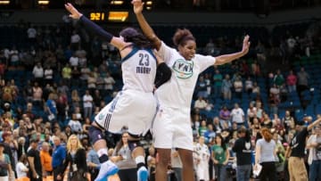 Jun 27, 2015; Minneapolis, MN, USA; Minnesota Lynx forward Maya Moore (23) and forward Reshanda Gray (21) celebrate the win after the game against the Phoenix Mercury at Target Center. The Minnesota Lynx beat the Phoenix Mercury 71-56. Mandatory Credit: Brad Rempel-USA TODAY Sports