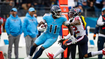 NASHVILLE, TN - DECEMBER 15: A.J. Brown #11 of the Tennessee Titans spins with a pass reception against Gareon Conley #22 of the Houston Texans during the third quarter at Nissan Stadium on December 15, 2019 in Nashville, Tennessee. Houston defeats Tennessee 24-21. (Photo by Brett Carlsen/Getty Images)