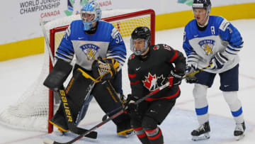 Aug 20, 2022; Edmonton, Alberta, CAN;Team Canada forward Connor Bedard (16) looks for a pass in font of Team Finland goaltender Juha Jatkola (31) during the second period in the championship game during the IIHF U20 Ice Hockey World Championship at Rogers Place. Mandatory Credit: Perry Nelson-USA TODAY Sports