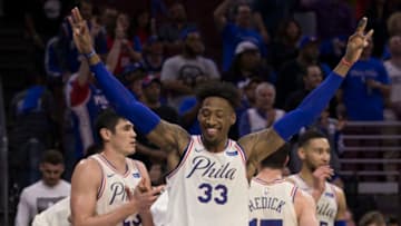 PHILADELPHIA, PA - APRIL 14: Robert Covington #33, Ersan Ilyasova #23, JJ Redick #17, and Ben Simmons #25 of the Philadelphia 76ers celebrate from the bench against the Miami Heat during Game One of the first round of the 2018 NBA Playoff at Wells Fargo Center on April 14, 2018 in Philadelphia, Pennsylvania. NOTE TO USER: User expressly acknowledges and agrees that, by downloading and or using this photograph, User is consenting to the terms and conditions of the Getty Images License Agreement. (Photo by Mitchell Leff/Getty Images) *** Local Caption *** Robert Covington;Ersan Ilyasova;JJ Redick;Ben Simmons