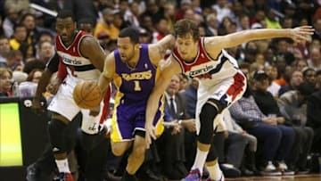 Nov 26, 2013; Washington, DC, USA; Los Angeles Lakers point guard Jordan Farmar (1) battles for the ball with Washington Wizards point guard John Wall (2) and Wizards power forward Jan Vesely (24) in the fourth quarter at Verizon Center. The Wizards won 116-111. Mandatory Credit: Geoff Burke-USA TODAY Sports
