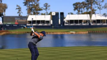 PONTE VEDRA BEACH, FLORIDA - MARCH 11: Rory McIlroy of Northern Ireland plays his shot from the 17th tee during the first round of THE PLAYERS Championship on THE PLAYERS Stadium Course at TPC Sawgrass on March 11, 2021 in Ponte Vedra Beach, Florida. (Photo by Mike Ehrmann/Getty Images)