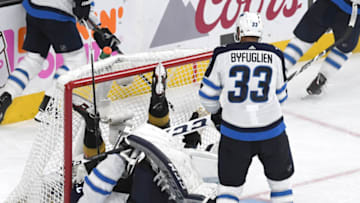 LAS VEGAS, NV - MAY 18: James Neal #18 of the Vegas Golden Knights crashed into Connor Hellebuyck #37 of the Winnipeg Jets during the third period in Game Four of the Western Conference Finals during the 2018 NHL Stanley Cup Playoffs at T-Mobile Arena on May 18, 2018 in Las Vegas, Nevada. The Golden Knights defeated the Jets 3-2. (Photo by Ethan Miller/Getty Images)
